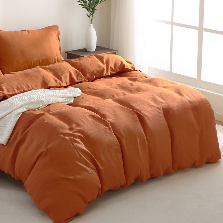Warm caramel linen duvet cover, adding earthy elegance to a cozy bedroom setting.