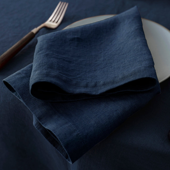 100% linen navy napkin, perfect for pairing with silver or gold tableware at special events.